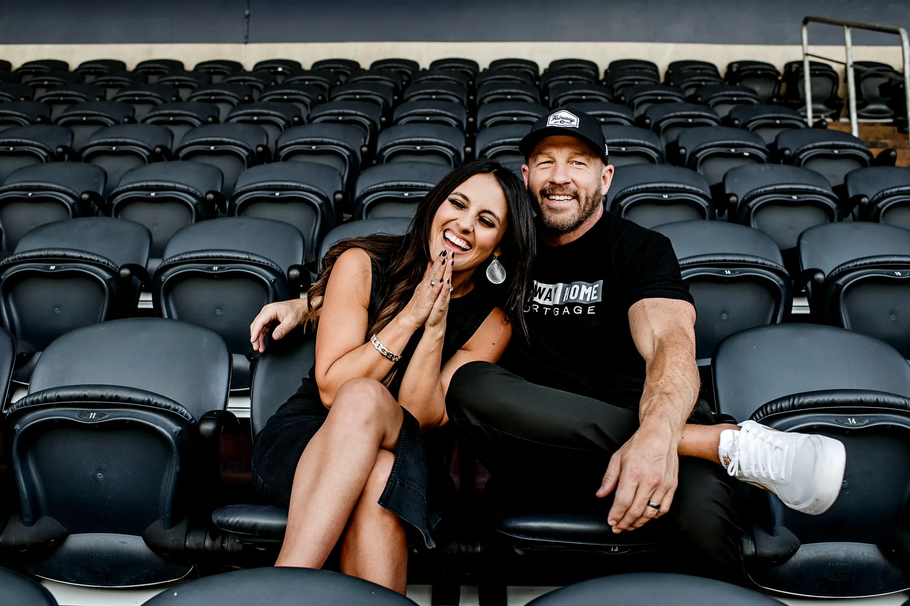 Darrin Wade and a companion seated in arena stands